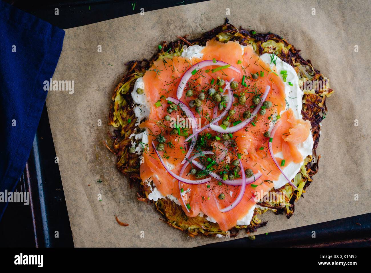 Potato Pancake Topped with Smoked Salmon and Labneh: Latkes topped with nova, capers, red onions, and fresh herbs Stock Photo