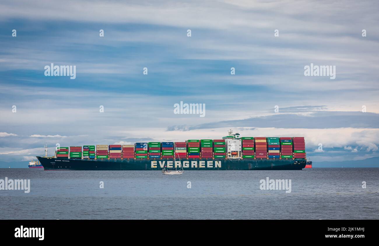 Evergreen container ship with full of cargo docked in port at Vancouver Island Nanaimo, Canada-July 18,2022. Travel photo, shipping industry, nobody, Stock Photo