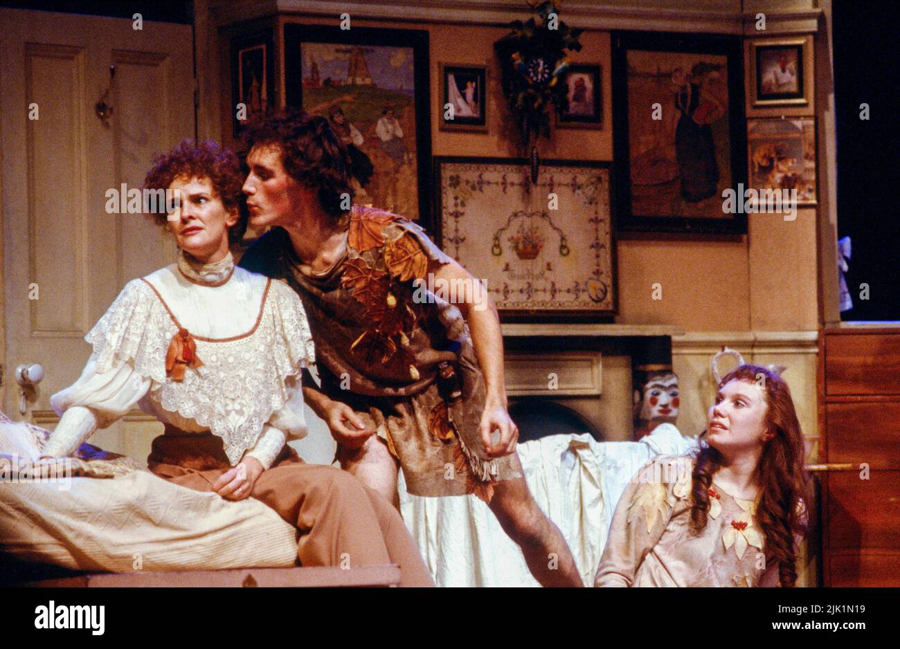 l-r: Frances Tomelty (Mrs Darling), Mark Rylance (Peter Pan), Katy Behean (Wendy) in PETER PAN by J M Barrie at the Royal Shakespeare Company (RSC), Barbican Theatre, London EC2  17/12/1983  set design: John Napier  costumes: Andreane Neofitou  lighting: David Hersey  fights: Malcolm Ranson  directors: John Caird & Trevor Nunn Stock Photo