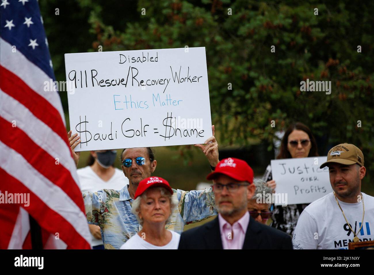 Family members and survivors from the organization 9/11 Justice protest against the Saudi Arabian-funded golf series and its tournament being held at the Trump National Golf Club in Bedminster, New Jersey, U.S., July 29, 2022. REUTERS/Eduardo Munoz Stock Photo