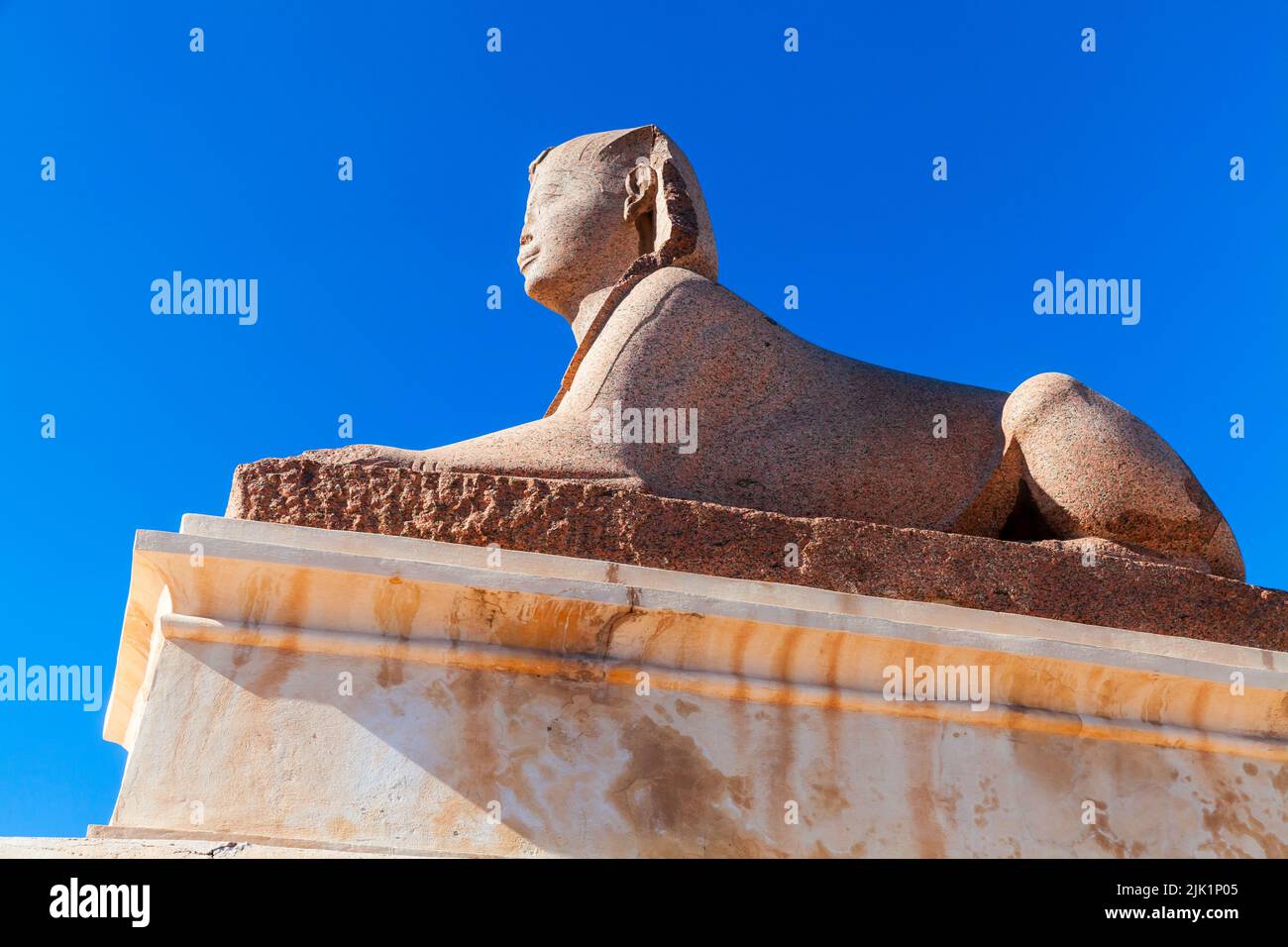 Statue of a Sphinx located at Pompeys Pillar park in Alexandria, Egypt Stock Photo