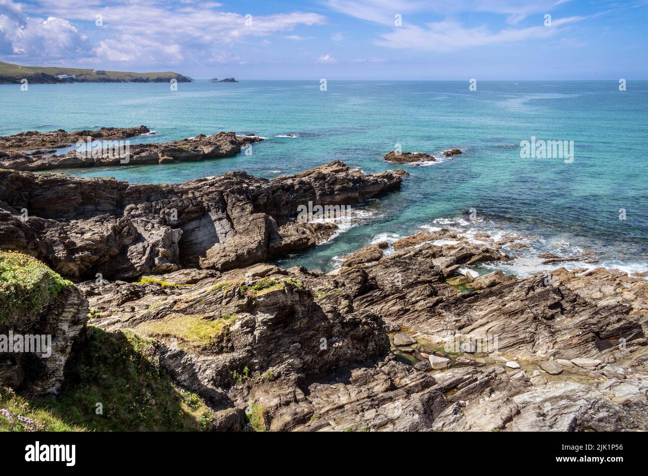 Rocks exposed by a low tide on the coast at Fistral in Newquay in Cornwall in the UK. Stock Photo