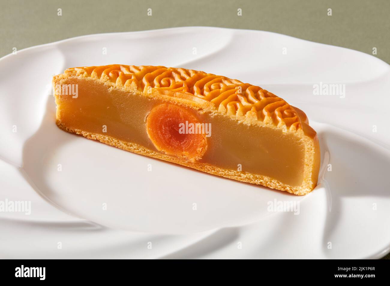 Cantonesestyle traditional egg yolk lotus paste mooncake for Chinese MidAutumn Festival