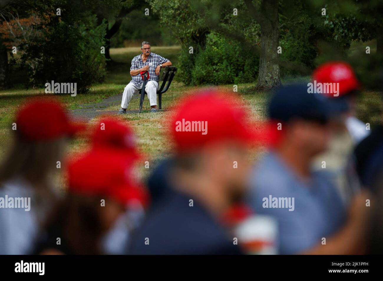 A man makes a pause while family members and survivors from the organization 9/11 Justice protest against the Saudi Arabian-funded golf series and its tournament being held at the Trump National Golf Club in Bedminster, New Jersey, U.S., July 29, 2022. REUTERS/Eduardo Munoz     TPX IMAGES OF THE DAY Stock Photo