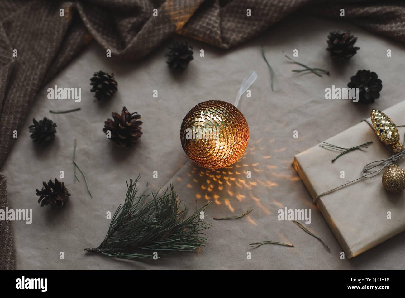 Christmas composition on craft paper background with gift box, fir ...