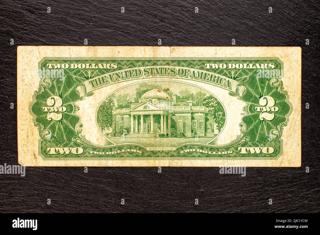 One 1953 US two dollar bill on a slate stone, close-up, top view Stock Photo