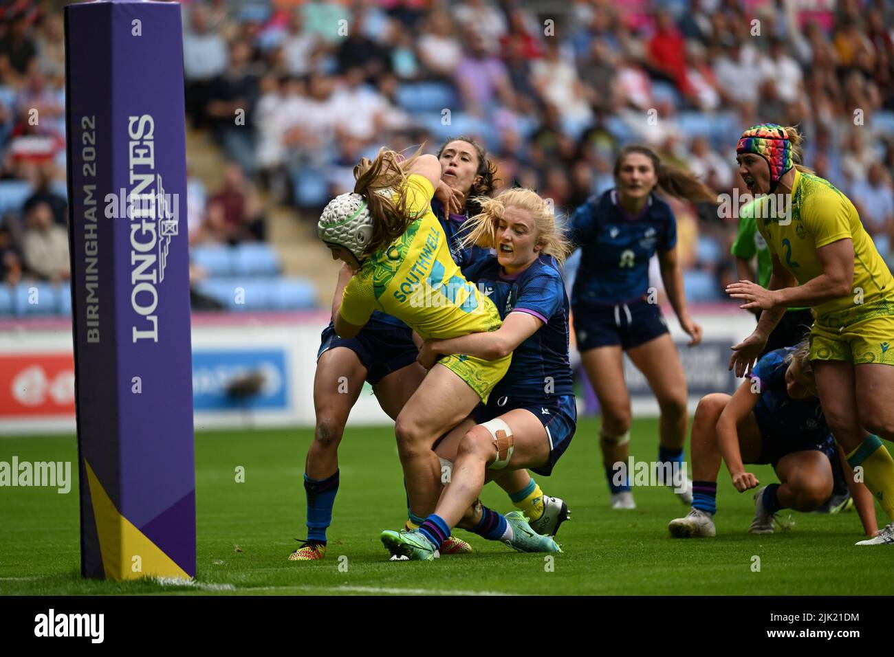 Faith Nathan of Australia scores a try during the Rugby Sevens at the Commonwealth Games at