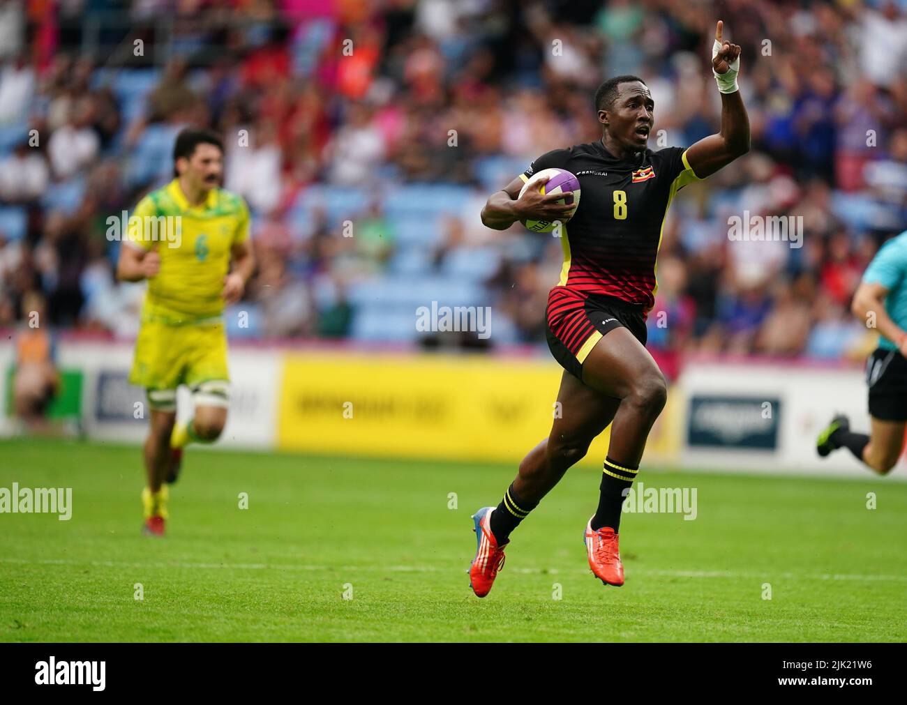 Uganda's Desire Ayera celebrates scoring against Australia at Coventry