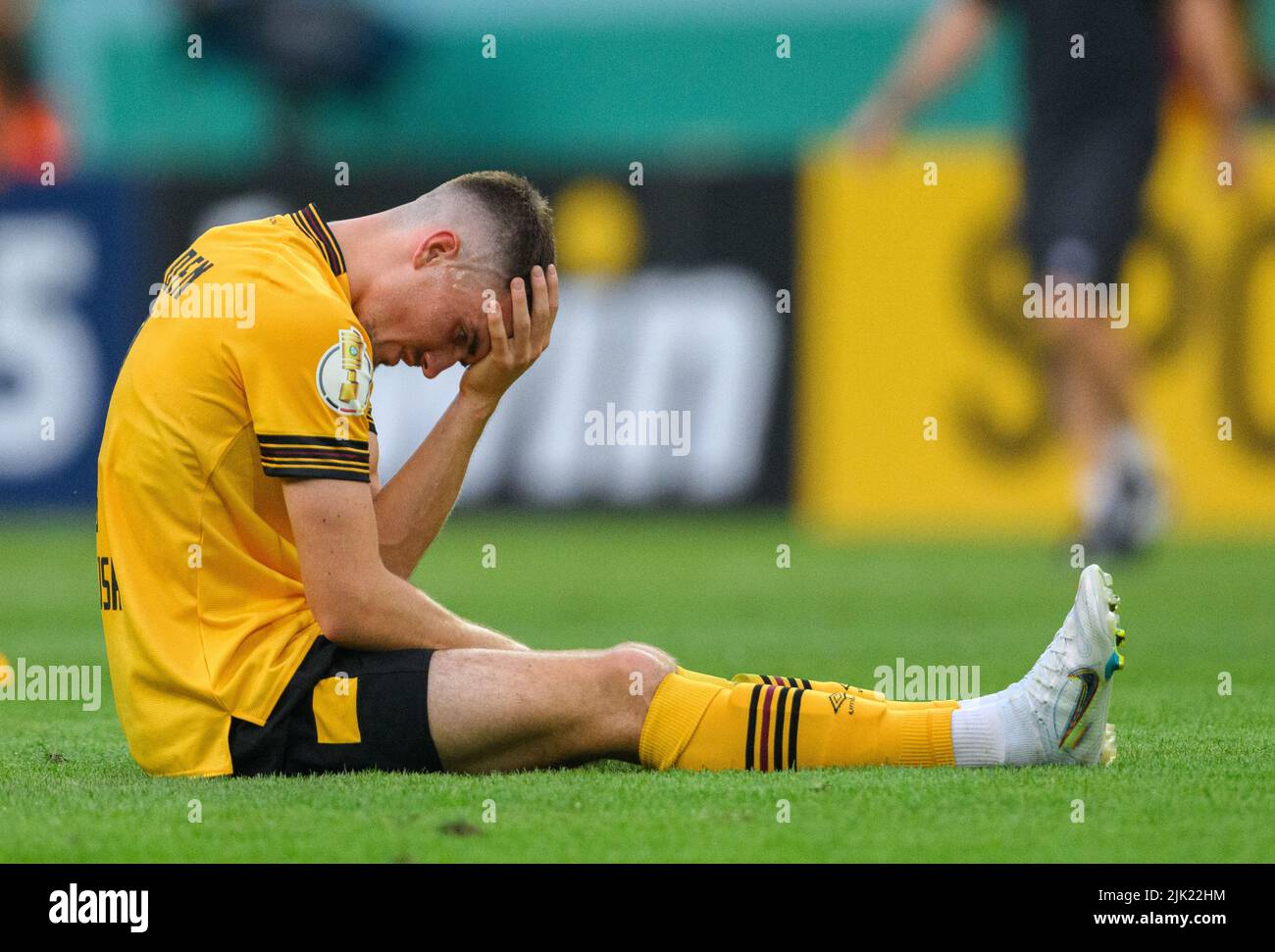 Dresden, Germany. 23rd July, 2022. Soccer: 3rd league, SG Dynamo Dresden - TSV  1860 Munich, Matchday 1, Rudolf Harbig Stadium. Dynamo's Kevin Ehlers  (l-r), Tim Knipping and Dennis Borkowski emotional. Credit: Robert