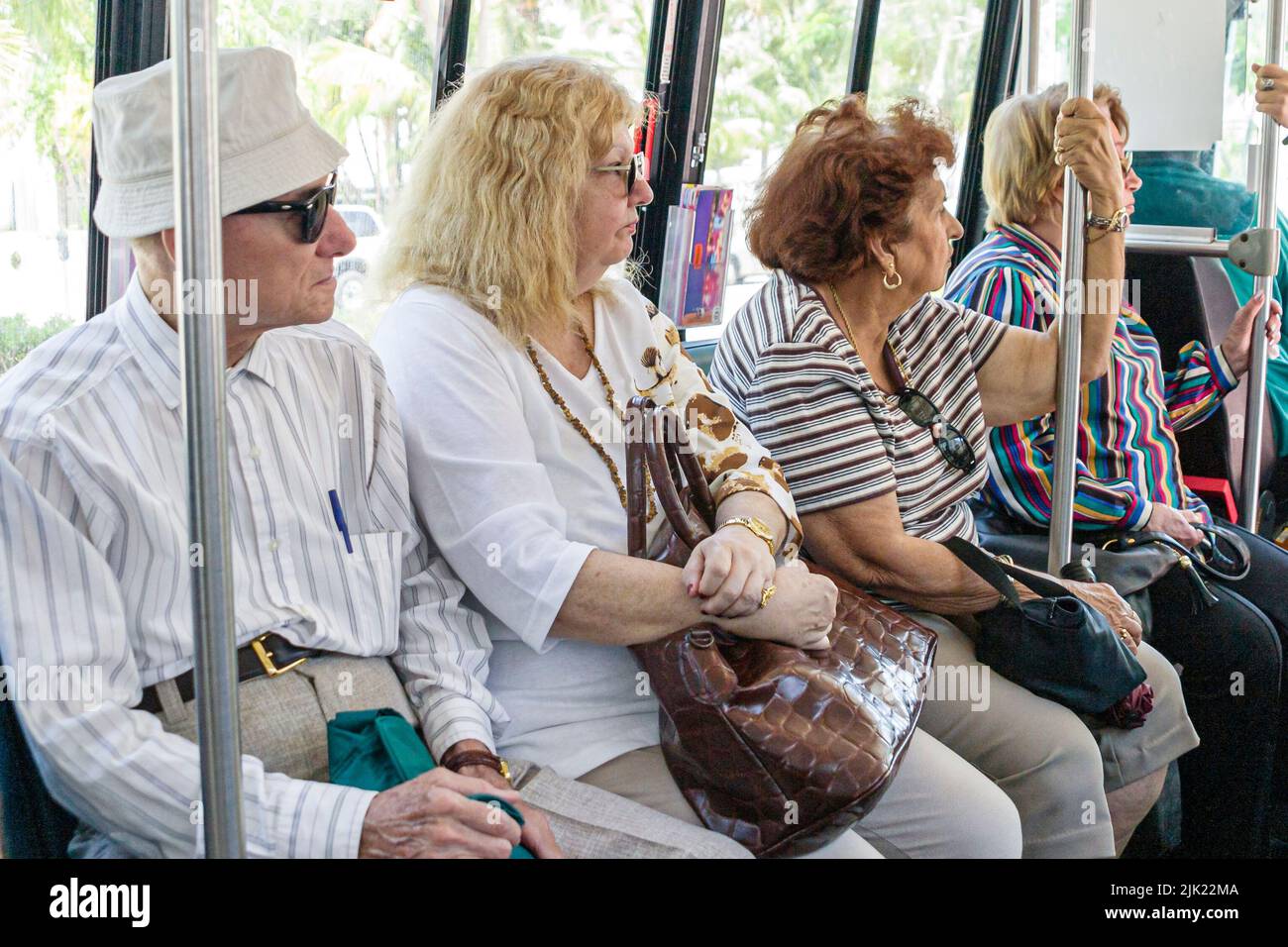 Miami Beach Florida,Miami-Dade Metrobus onboard inside interior public bus passenger passengers rider riders,transportation group people person Stock Photo
