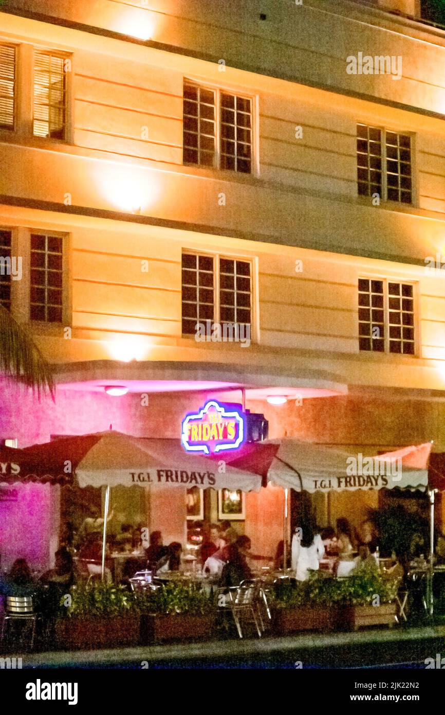Miami Beach Florida,South Beach,Ocean Drive,night nightlife evening al fresco sidewalk outside outdoors tables,dining eating out restaurant neon sign Stock Photo