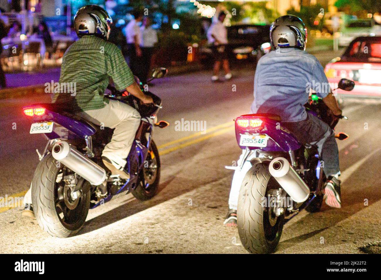 Miami Beach Florida,South Beach Ocean Drive night nightlife evening,traffic motorcycles motorcycle riders cruising Stock Photo
