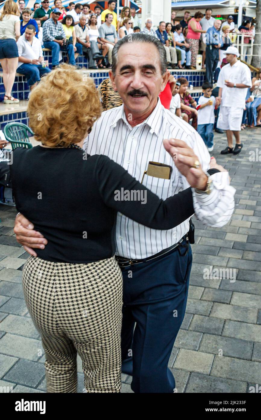 Miami Florida,Bayfront Marketplace shopping shoppers dance dancing,Hispanic Latin Latino immigrants minority couple man male woman female Stock Photo