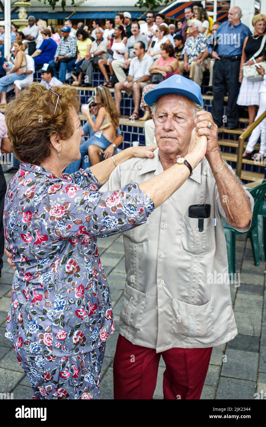 Miami Florida,Bayfront Marketplace shopping shoppers dancing,Hispanic Latin Latino immigrants minority couple seniors senior man male woman female Stock Photo