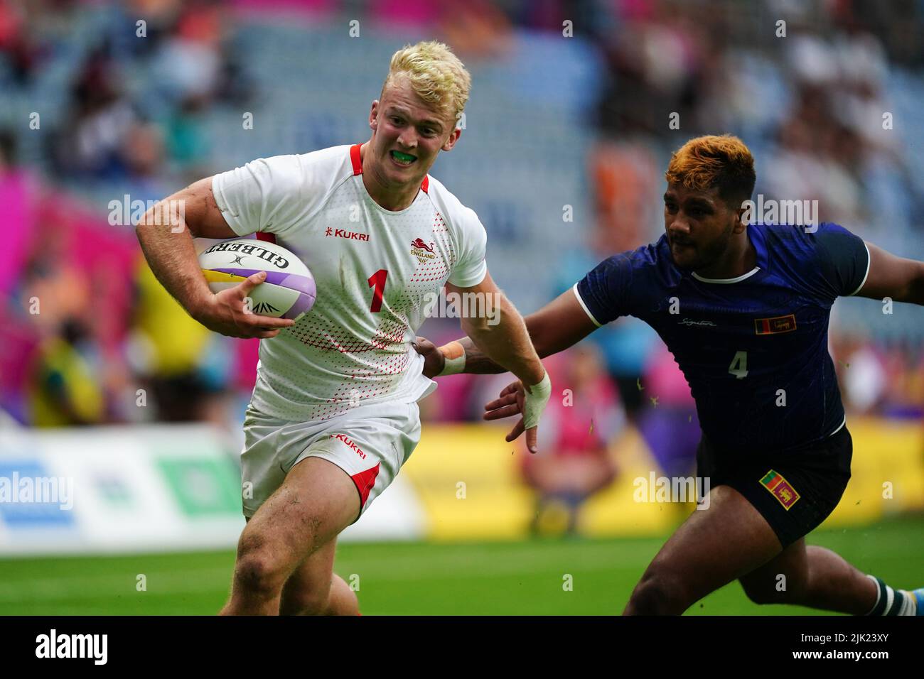 England's Jamie Adamson is tackle by Sri Lanka's Chathura Senavirathine