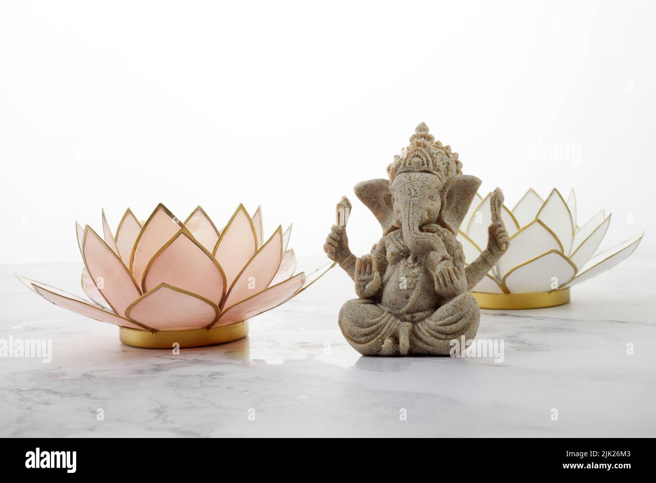 Happy Ganesh Chaturthi festival, Lord Ganesha statue with lotus on marble background, Stock Photo