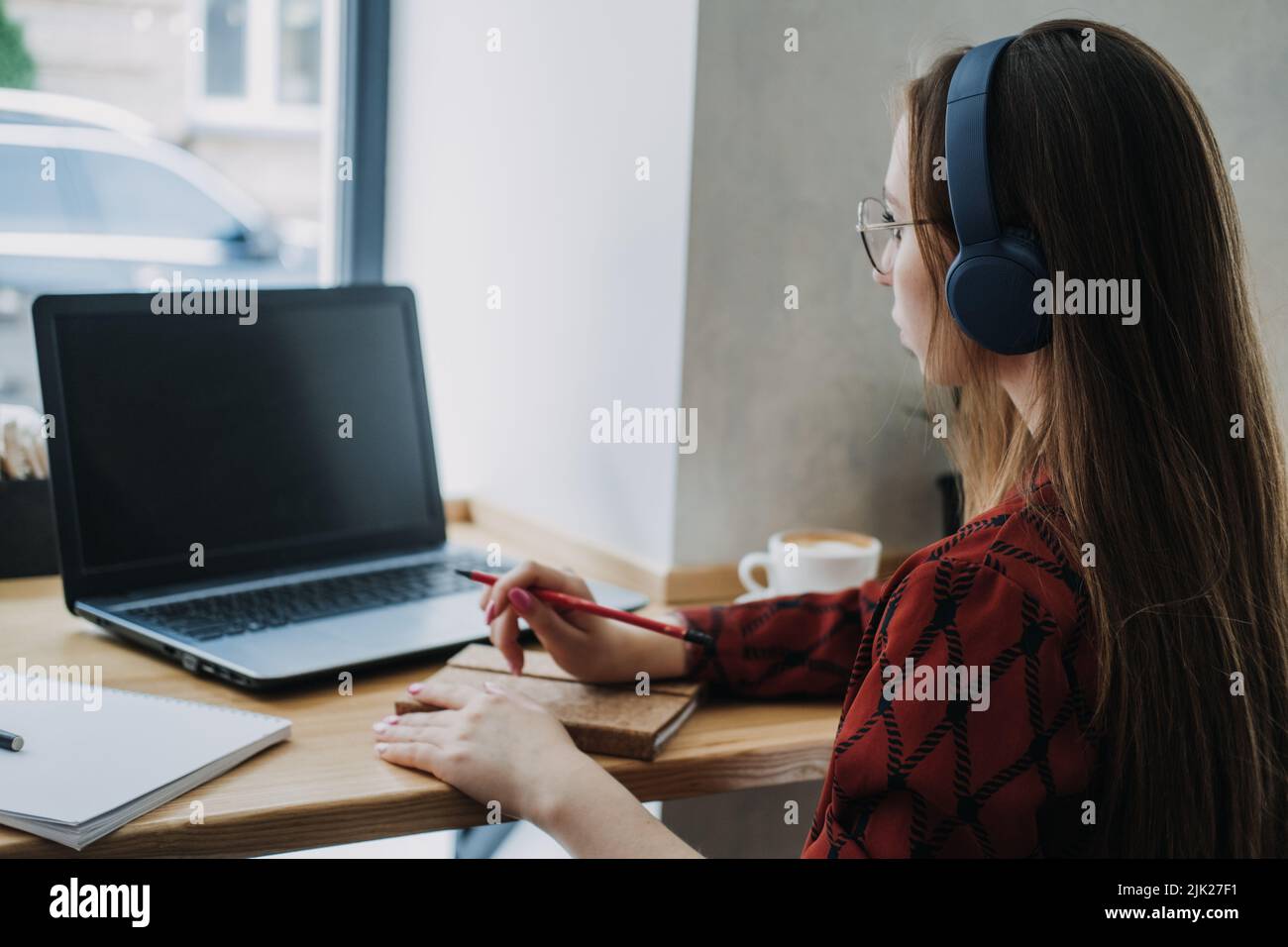 Outsourcing IT Projects, remote work, young professionals. female young programmer, developer working Stock Photo