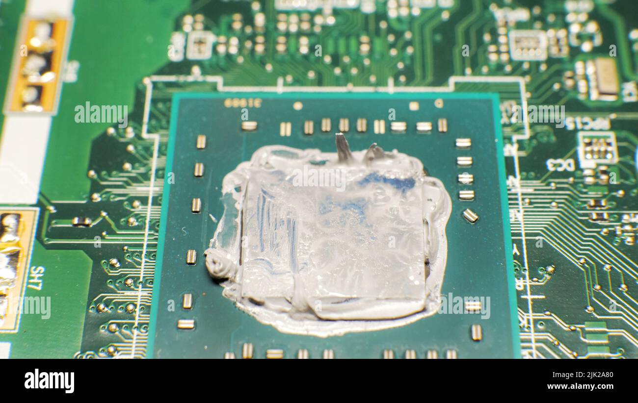 replacement, extrusion of thermal paste on the laptop processor. Thermal  paste for better cooling of the device Stock Photo - Alamy