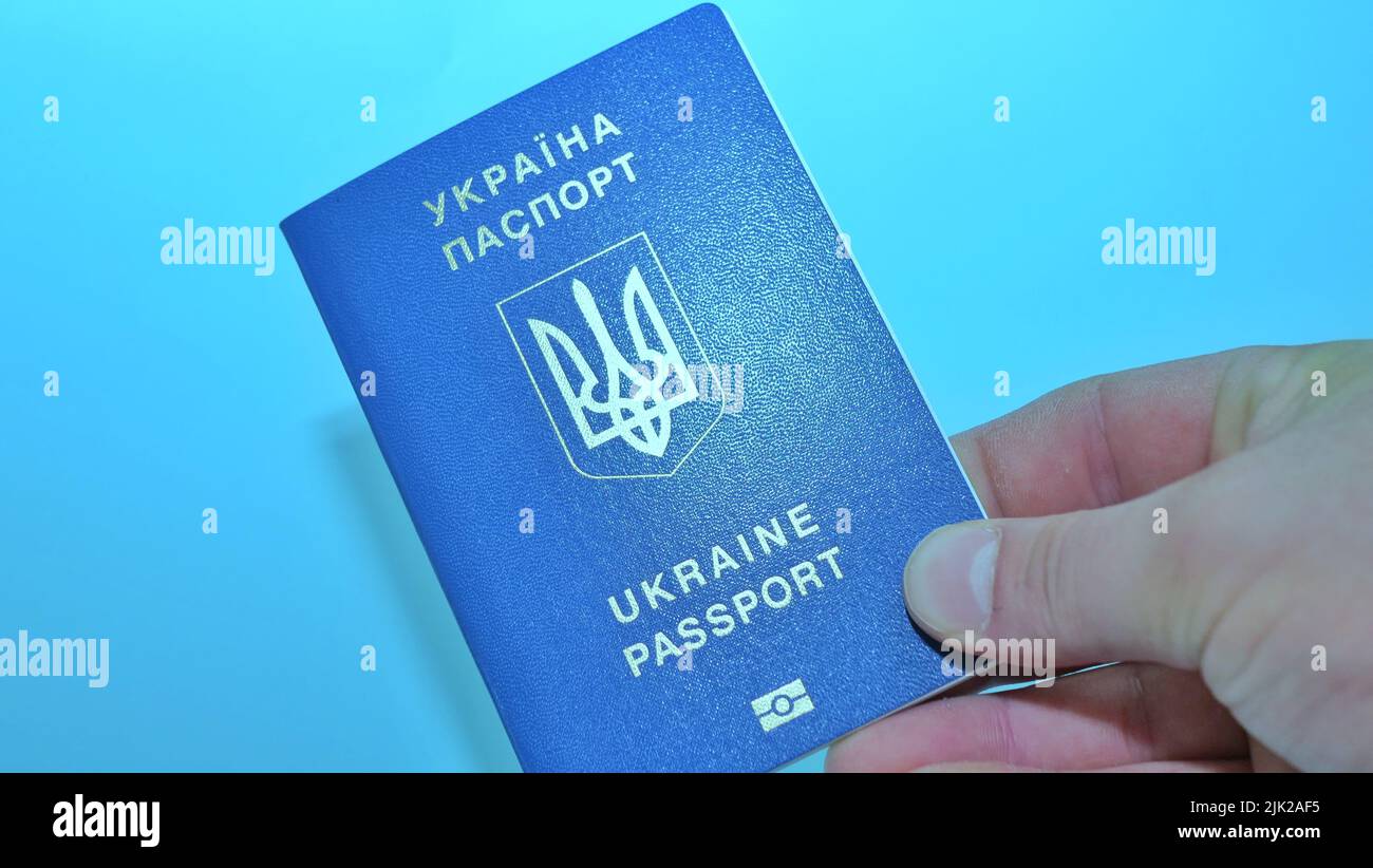 Ukrainian biometric passport id to travel the Europe without visas on the table. Inscription in Ukrainian Ukraine Passpor Stock Photo