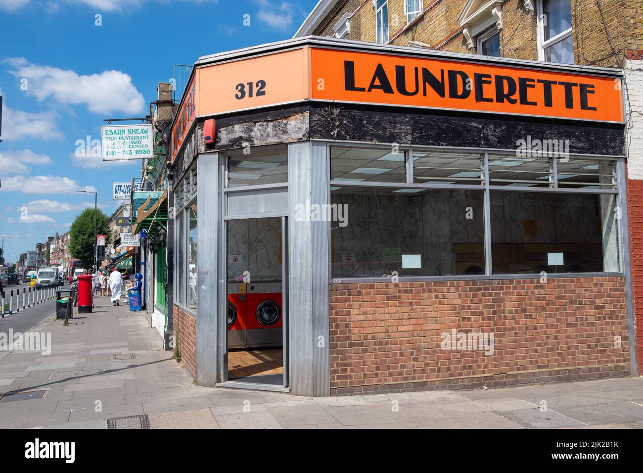 London, July 2022: Launderette on Uxbridge Road, west London high street. Stock Photo