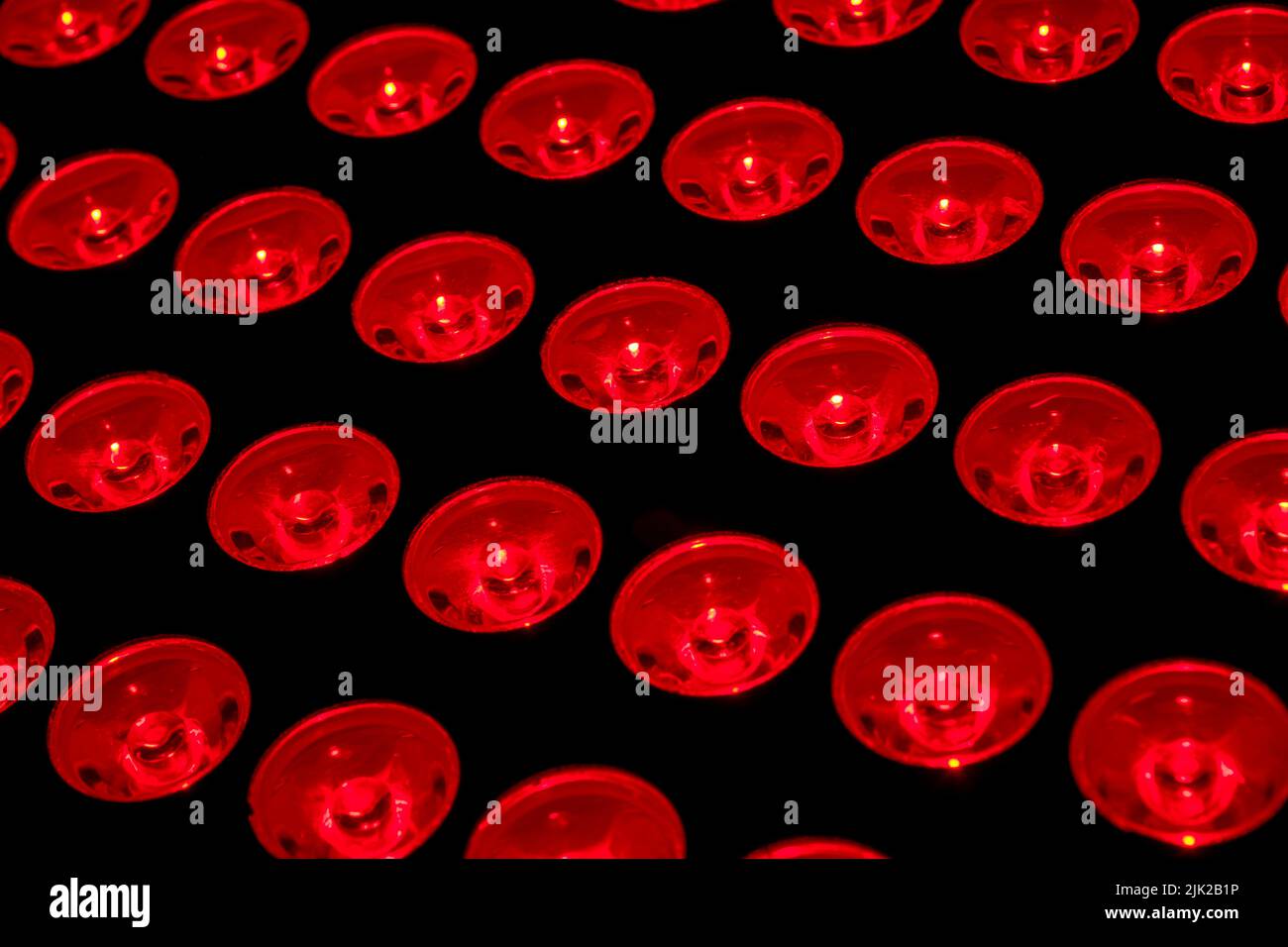 Full frame of red lights concept for recovery and rehabilitation therapy, skincare healing and rejuvenation procedure Stock Photo