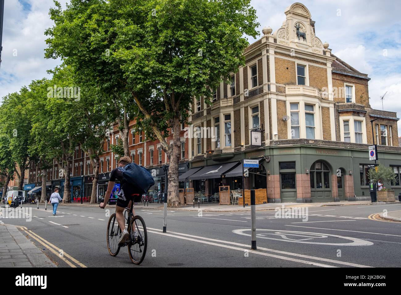 London- July 2022: Chiswick High Road summer scene, a long street of attractive high street shops in an aspirational area of West London Stock Photo