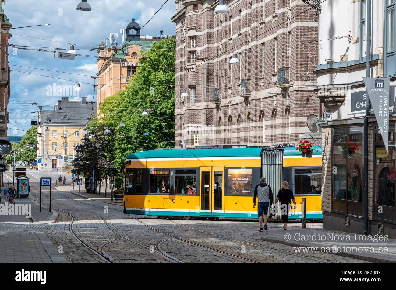 Tram on main street Drottninggatan in the city center of Norrkoping, Sweden. Norrkoping is a historic industrial town. Stock Photo