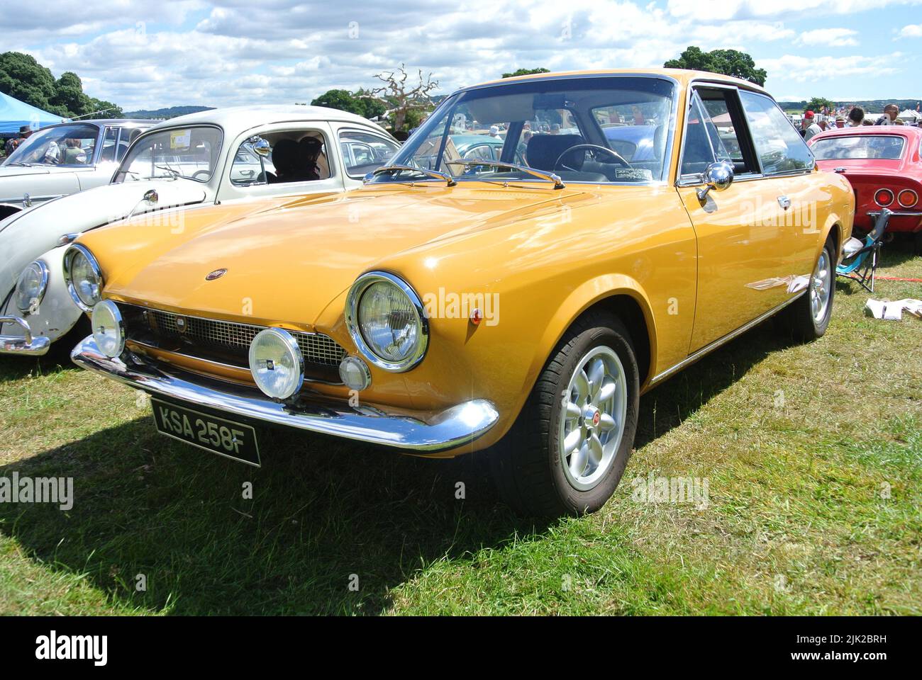A 1968 Fiat 124 Sport Coupe parked on display at the 47th Historic Vehicle Gathering classic car show, Powderham, Devon, England, UK. Stock Photo