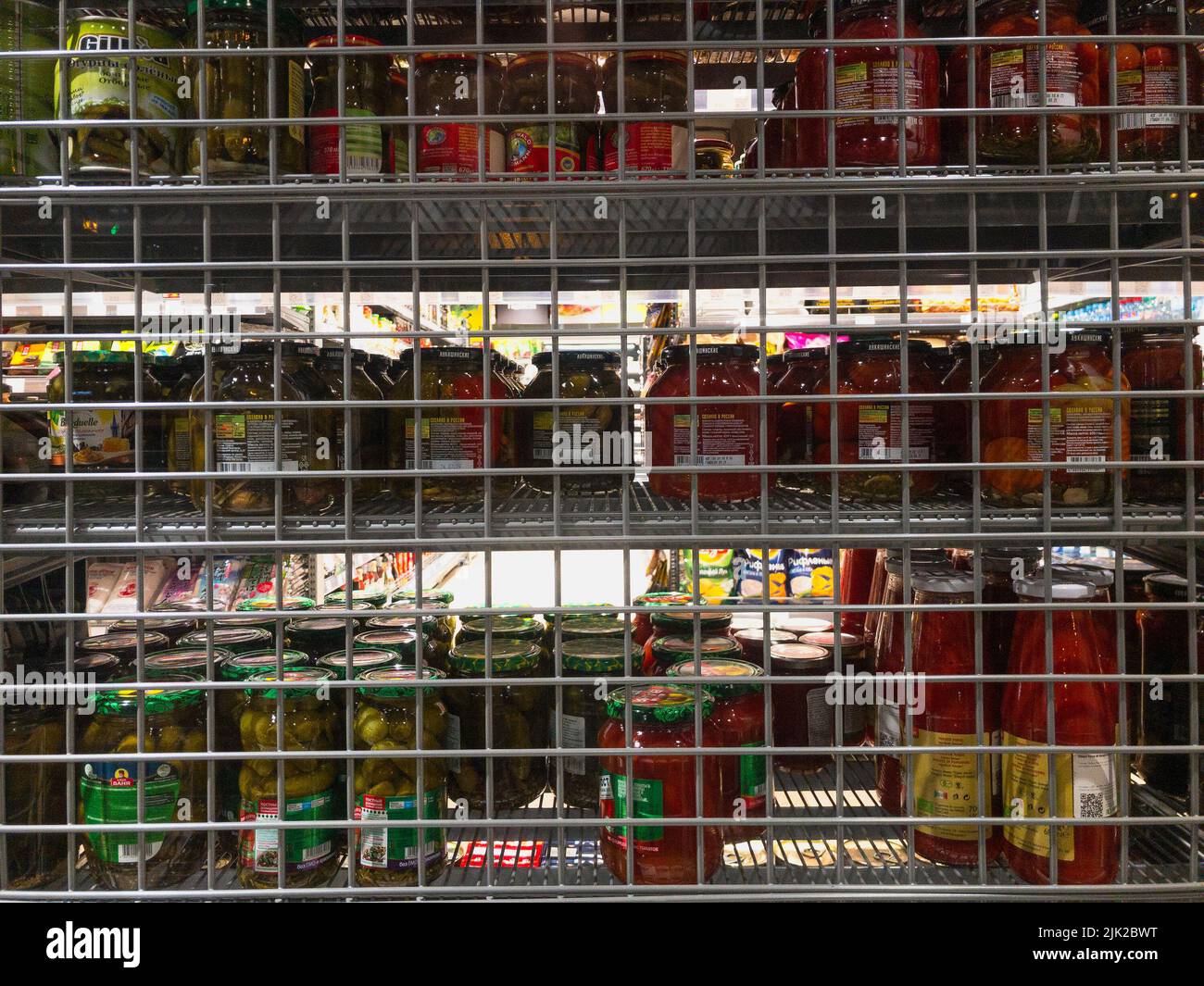canned glassware vegetables behind a grid Stock Photo