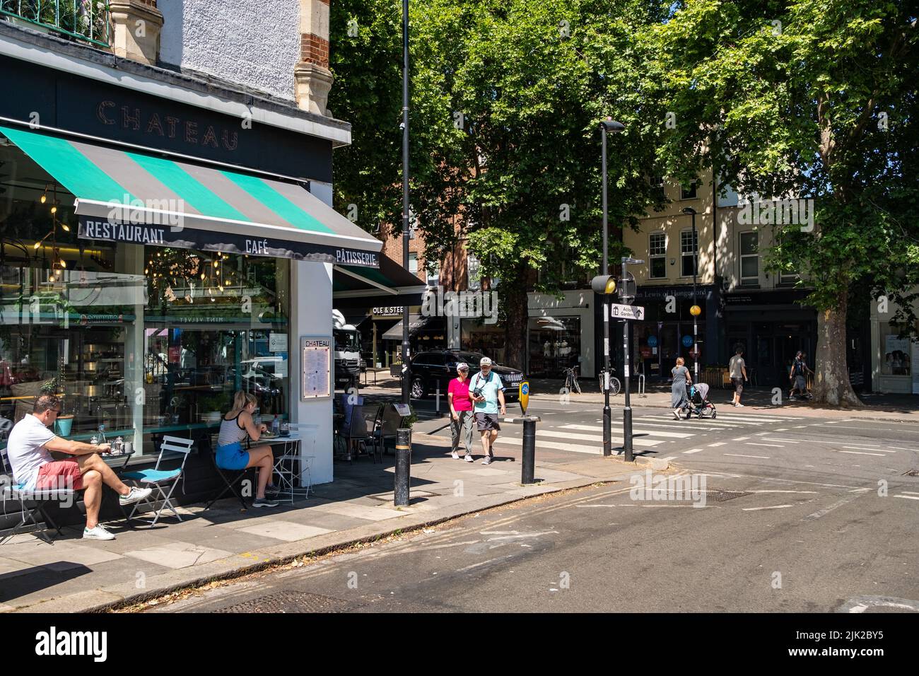 London- July 2022: Chiswick High Road summer scene, a long street of attractive high street shops in an aspirational area of West London Stock Photo