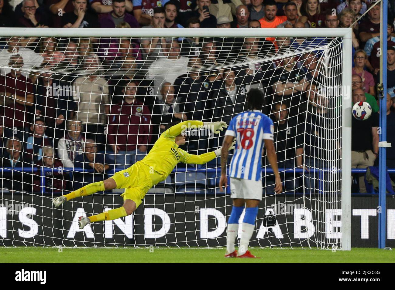 Lee Nicholls #21 of Huddersfield Town dives as the ball hits the post ...