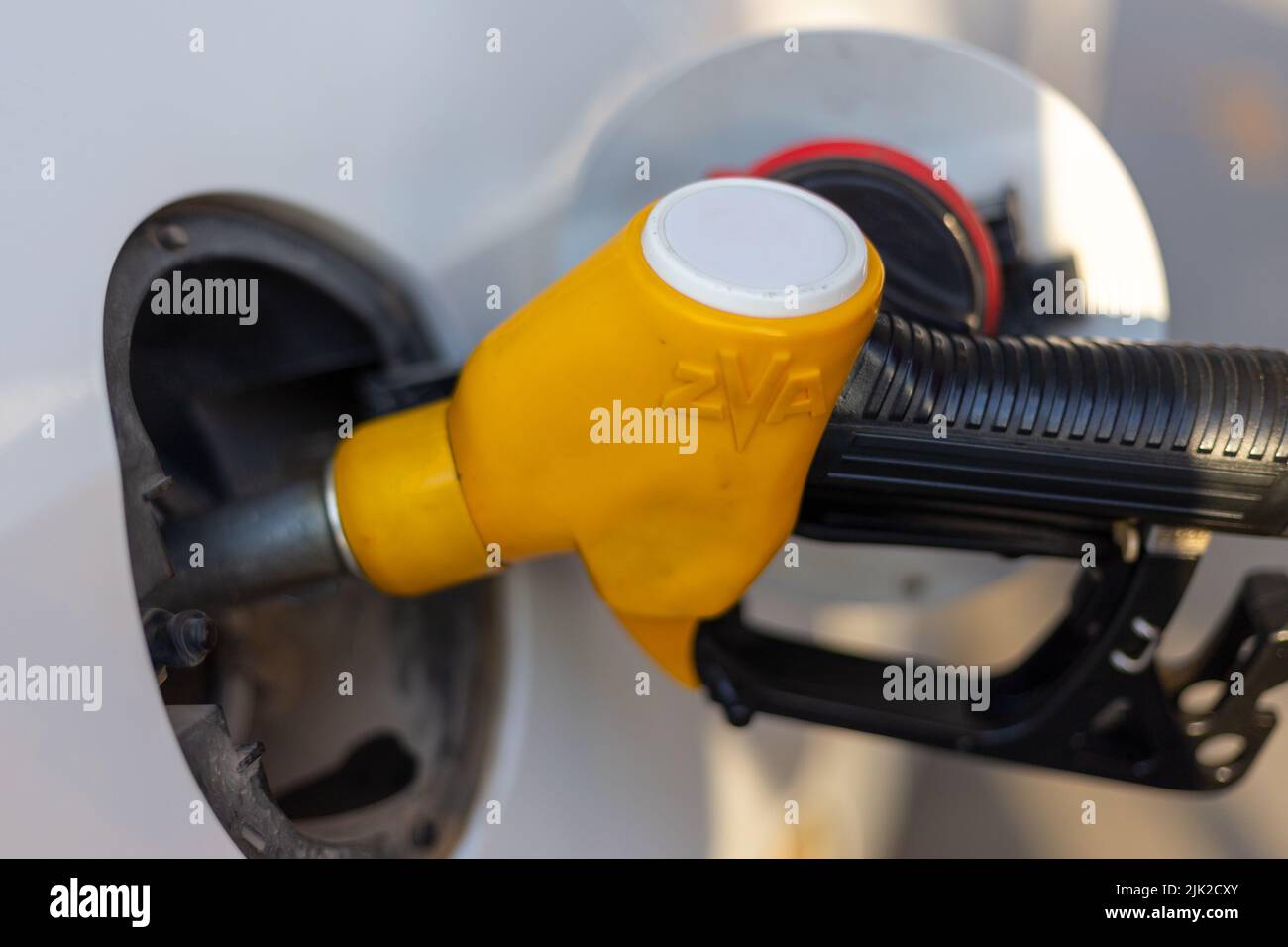 Fuel pump that fills the vehicle with fuel. The fuel pump is yellow in