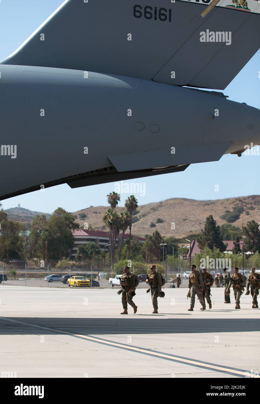 U.S. Marines with 3rd Battalion, 5th Marine Regiment, 1st Marine Division board a U.S. Air Force C-17 Globemaster III aircraft during a joint training exercise on Marine Corps Air Station Camp Pendleton, California, July 25, 2022. This exercise included aircraft from five different U.S. Air Force squadrons and Marines with 3/5, 1st MarDiv to enhance their expeditionary operations in a joint-training environment. This was the first time MCAS Camp Pendleton staged five C-17 Globemaster III aircraft on the air station at one time. (U.S. Marine Corps photo by Cpl. Shaina Jupiter) Stock Photo