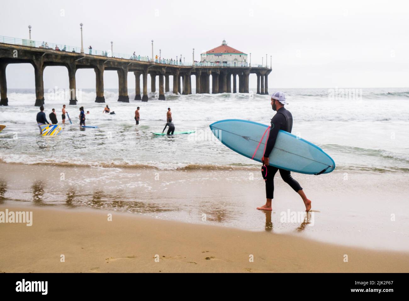 Surfer at the Pier, Manhattan Beach, Los Angeles County, California, United States of America Stock Photo