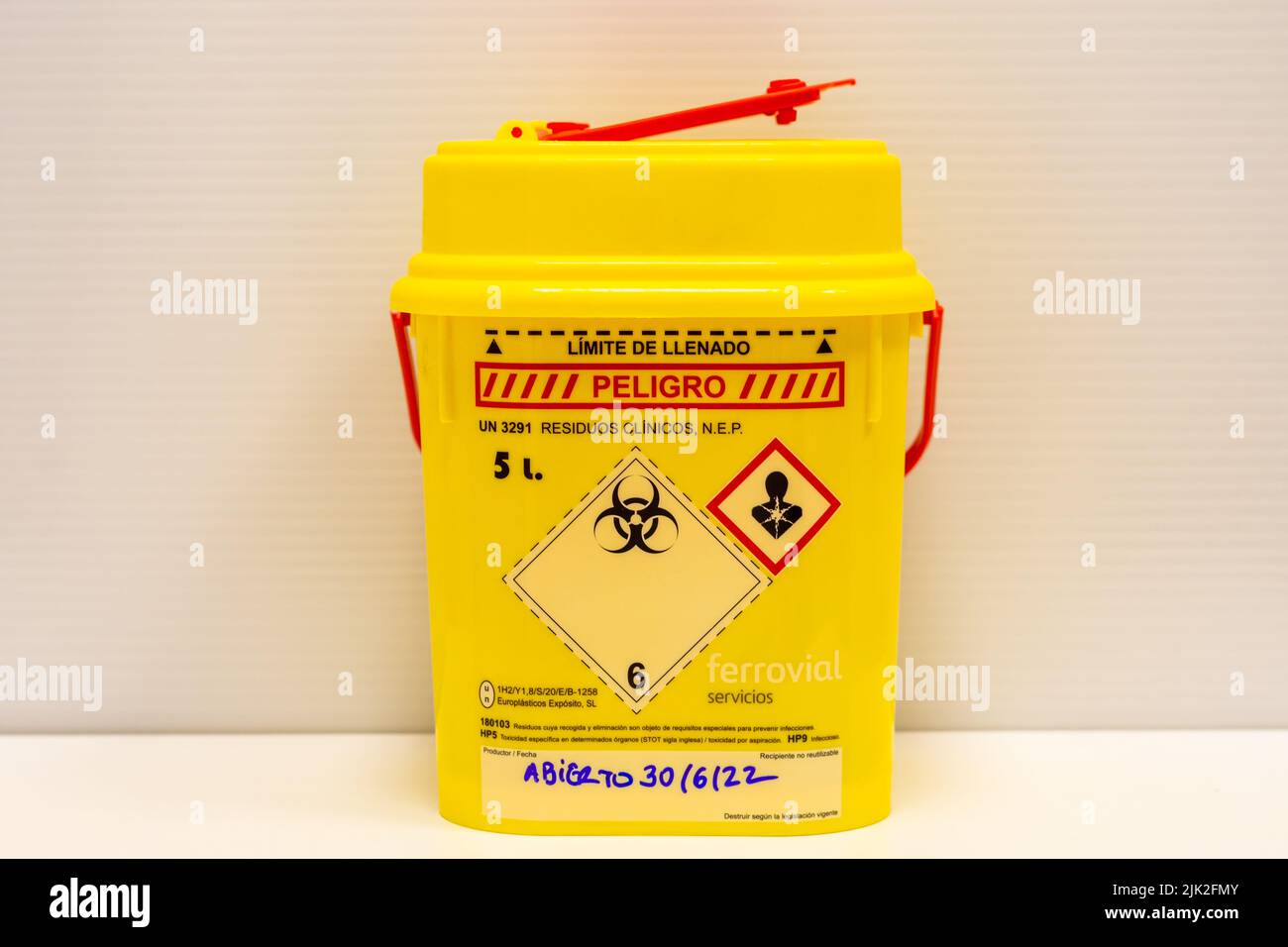 Yellow container for hazardous hospital biological waste that poses a risk to human health and the environment Stock Photo