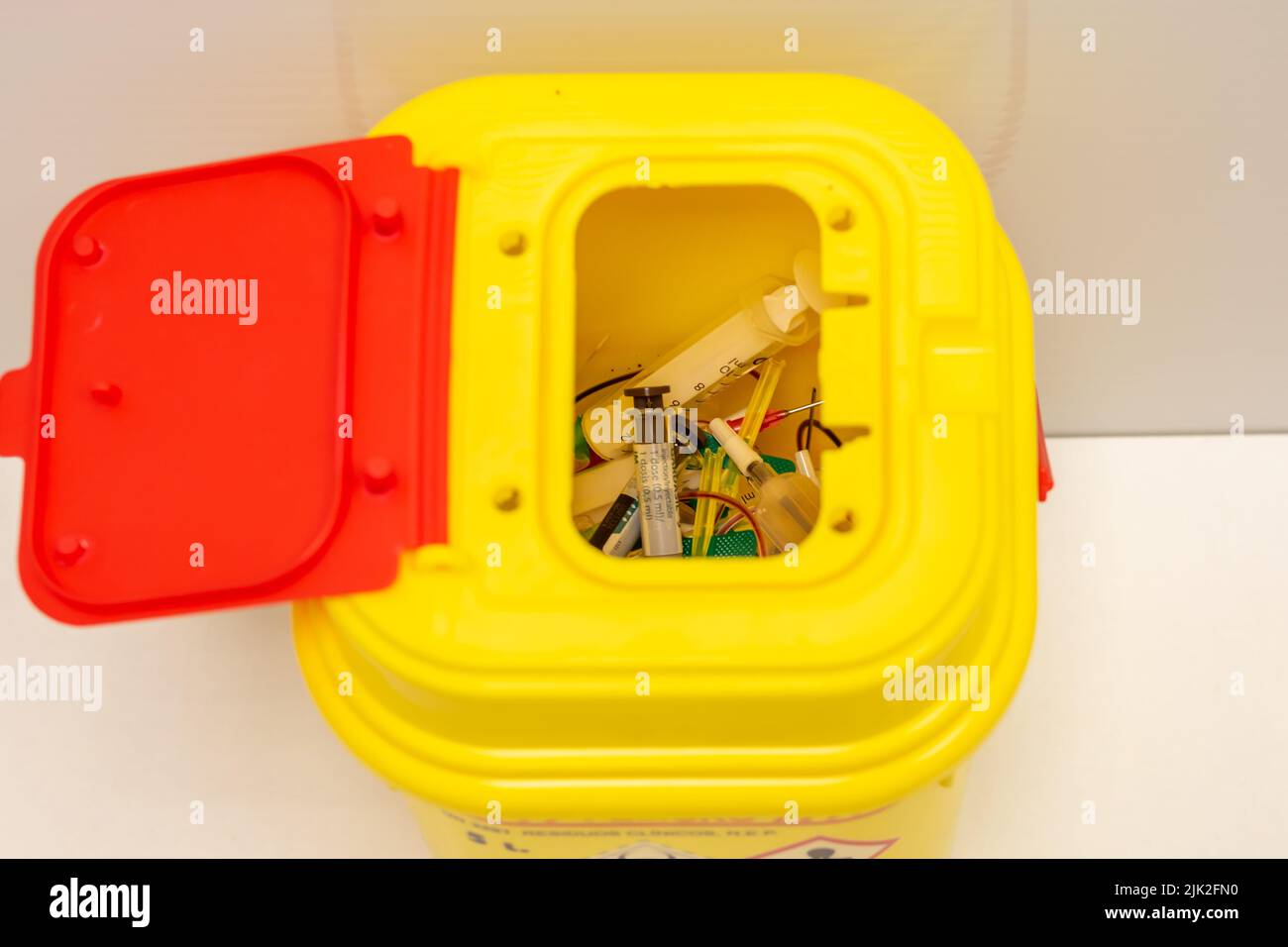 Yellow container for hazardous hospital biological waste that poses a