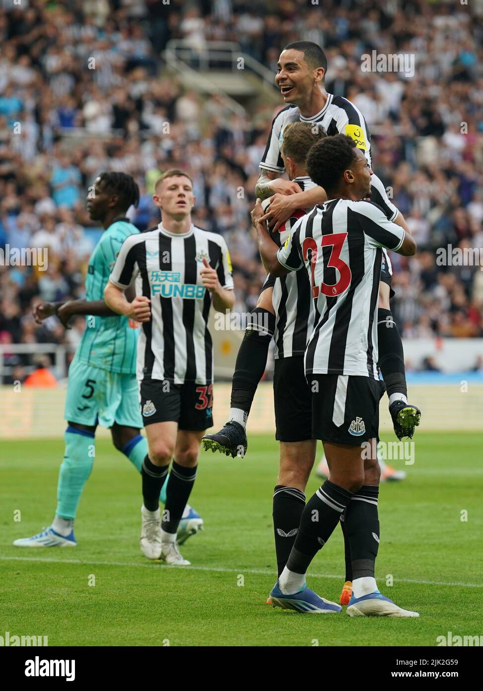 Newcastle's Chris Wood (hidden) celebrates scoring their side's first goal of the game from the penalty spot with team-mates during a pre-season friendly match at St. James' Park, Newcastle. Picture date: Friday July 29, 2022. Stock Photo
