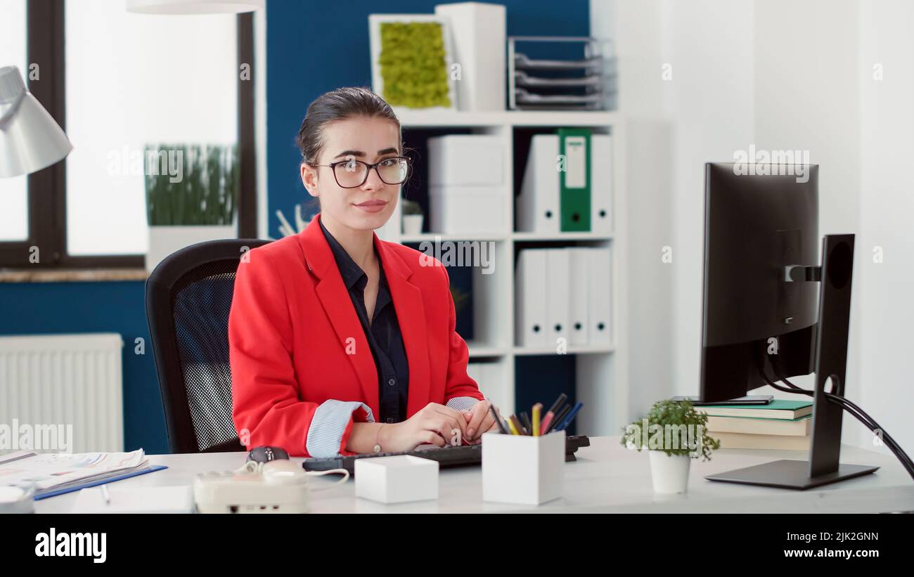 Female worker using charts statistics to plan strategy on computer ...