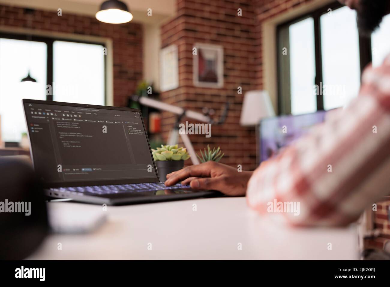 African american engineer programming app code, developing online software with cloud server and firewall security. Coding new user interface with binary code html program, web development. Stock Photo