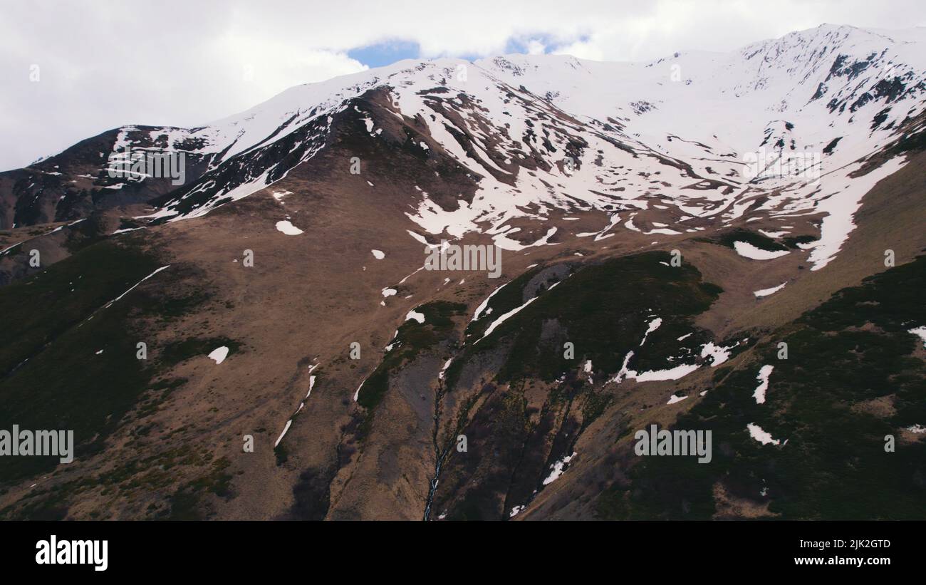 Climate change. Snow visible on the mountain. Aerial drone view. High quality photo Stock Photo