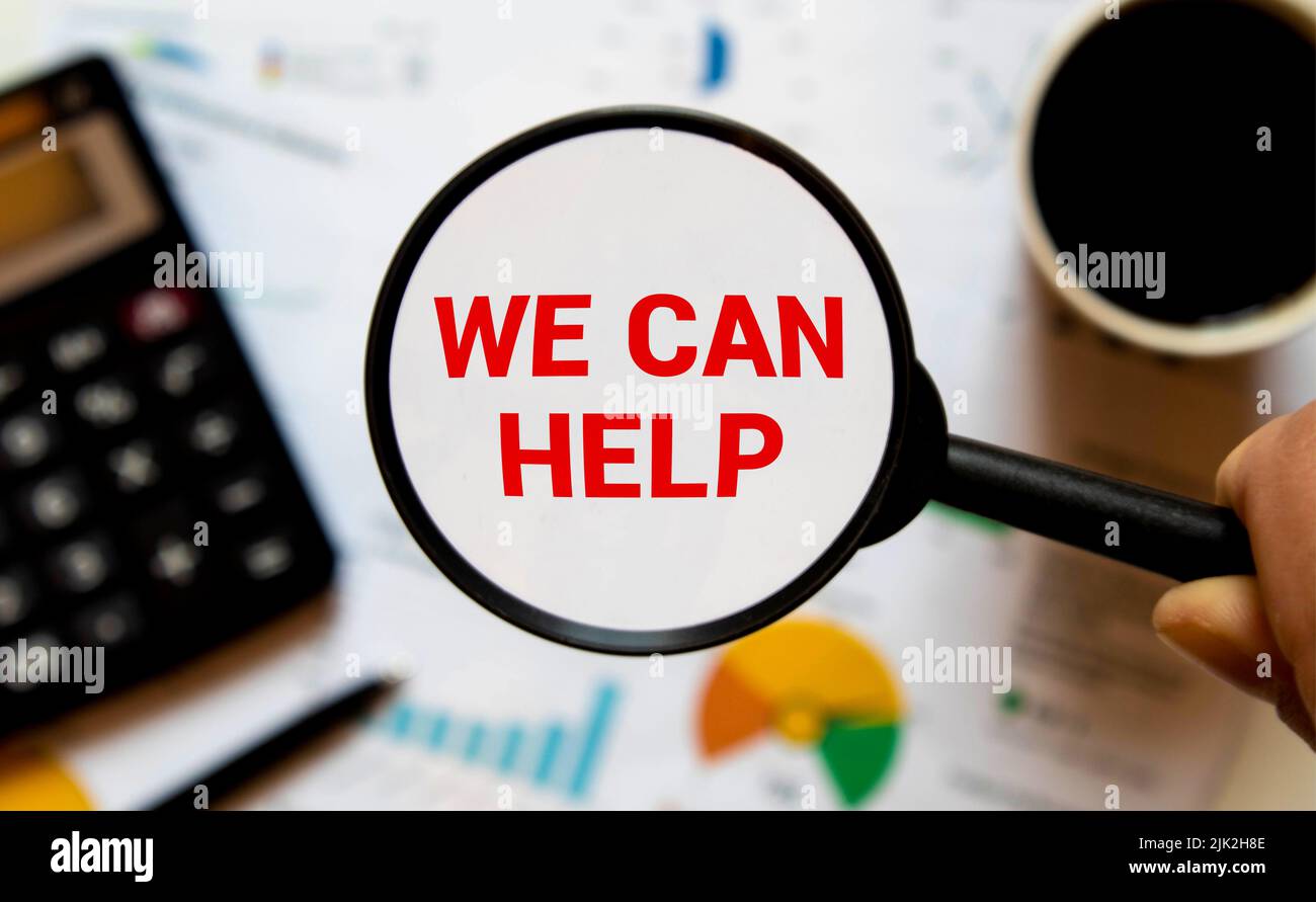 Paper note written with WE CAN HELP inscription on cork board Stock Photo