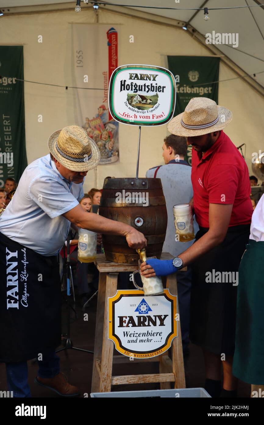 Langenargen, Germany. 29th July, 2022. The 47th Lakeside Festival at lake of constance („Bodensee“) was opened by ceremonical act with representatives of politics and municipality. With the traditional tapping of the barrel, a bavarian tradition that started 1850 at Munic-Wiesn (Oktoberfest). 3 days program started with orchestra and activities such as parachuting by the Bundeswehr, fireworks and a family fair for children. Montfort Castle, built in Moorish style in 1866, is Langenargen's magnificent landmark. Credit: RW Adventure Photography/Alamy Live News Stock Photo