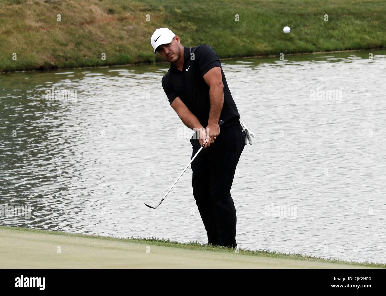 Bedminster, USA. 29th July, 2022. Brooks Koepka chips onto the green at