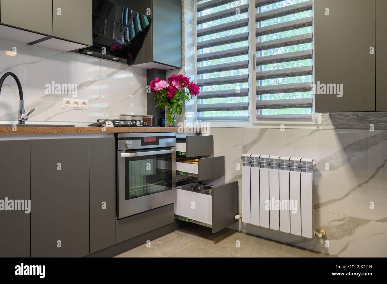 Interior of modern trendy grey kitchen Stock Photo - Alamy