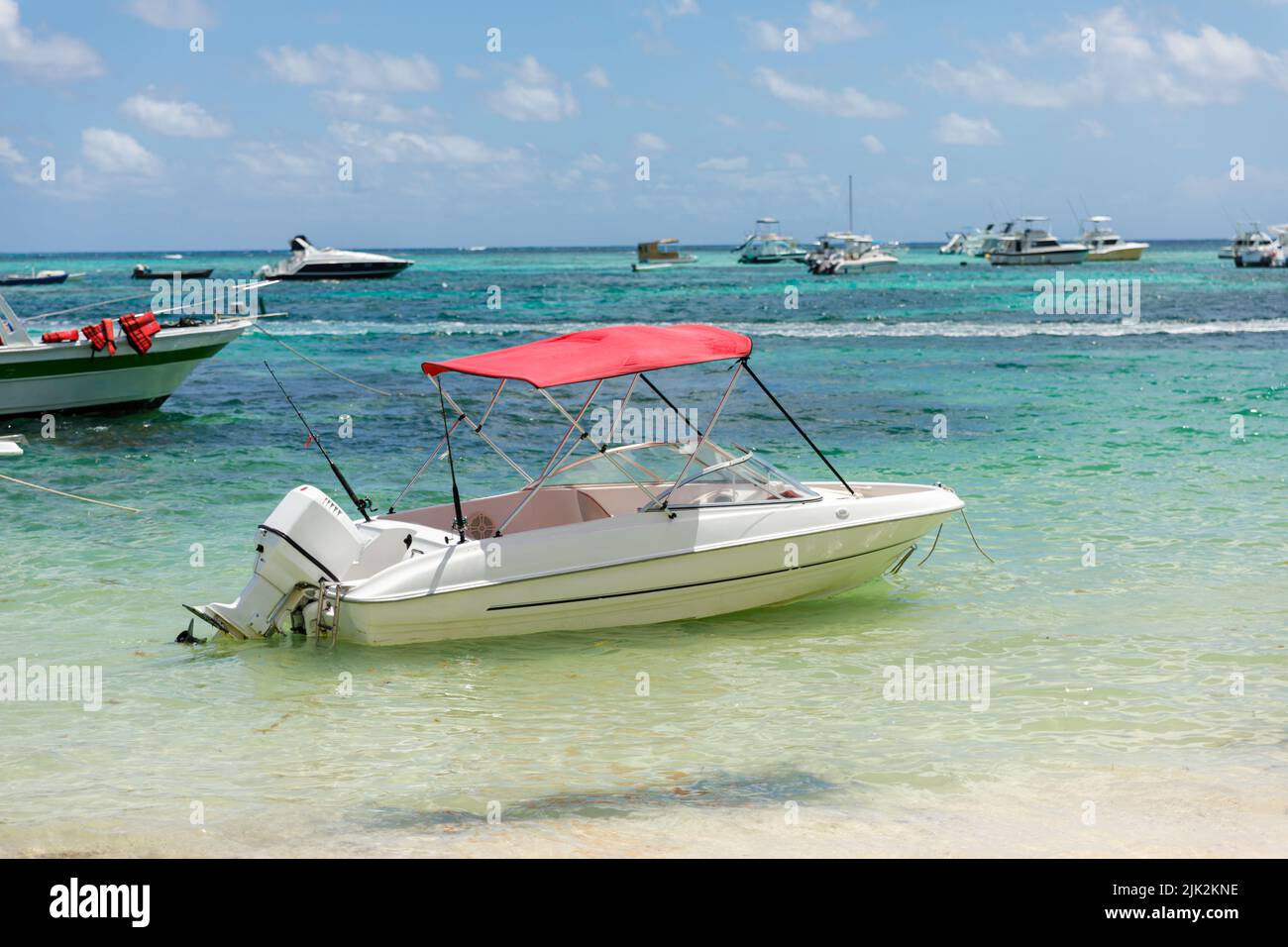 A motorboat parked on the Caribbean coast. Tourism business in the tropics, Stock Photo