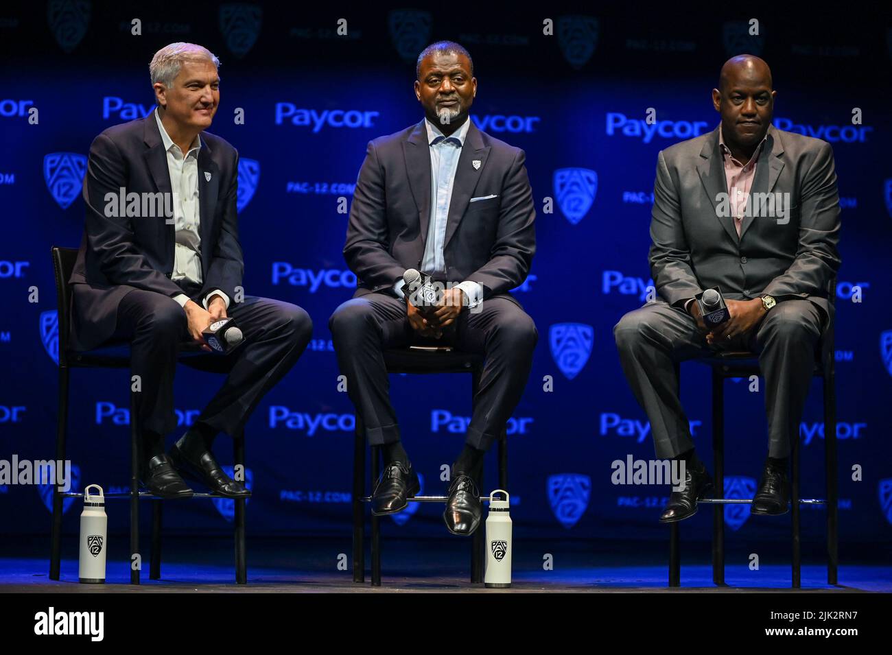 Pac-12 Commissioner George Kliavkoff (left), Pac-12 Senior Associate Commissioner Merton Hanks (center) and Stanford University Director of Athletics Stock Photo