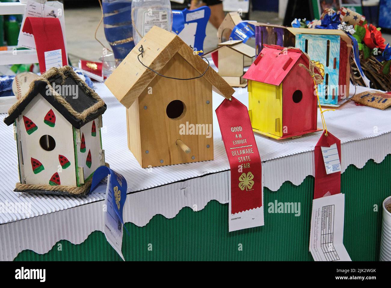 Three hand made wooden bird houses bear ribbons during a craft competition at the Delaware State Fair, Harrington, Delaware USA. Stock Photo