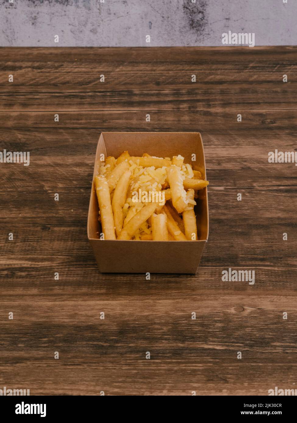 Truffle fries with shaved truffle flakes in cardboard tray Stock Photo Alamy