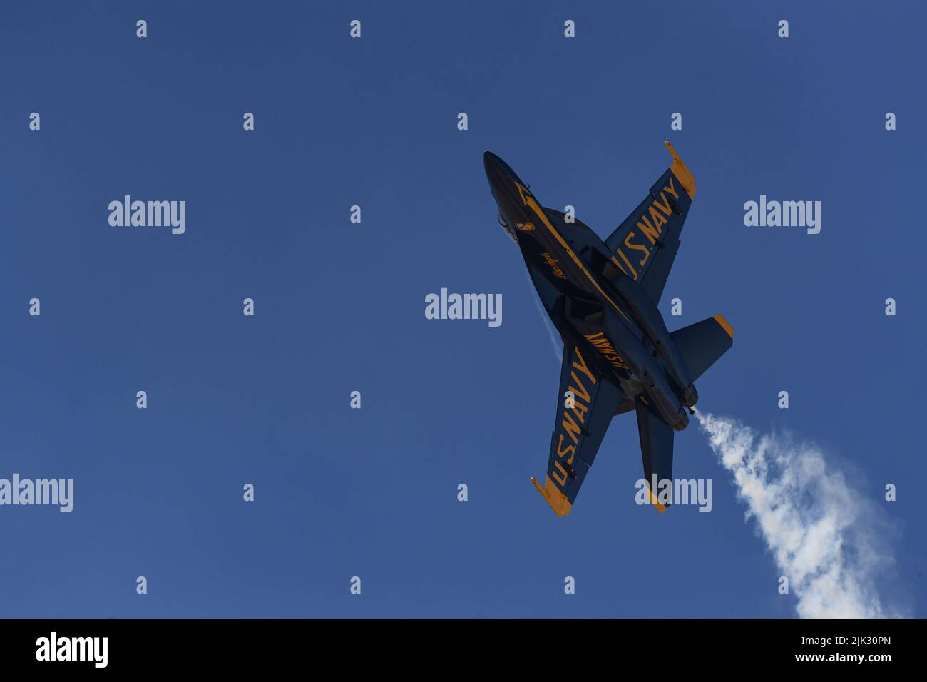 United States Navy Blue Angel F/A-18 Super Hornet steaks through the sky during winter training at NAF El Centro. Stock Photo