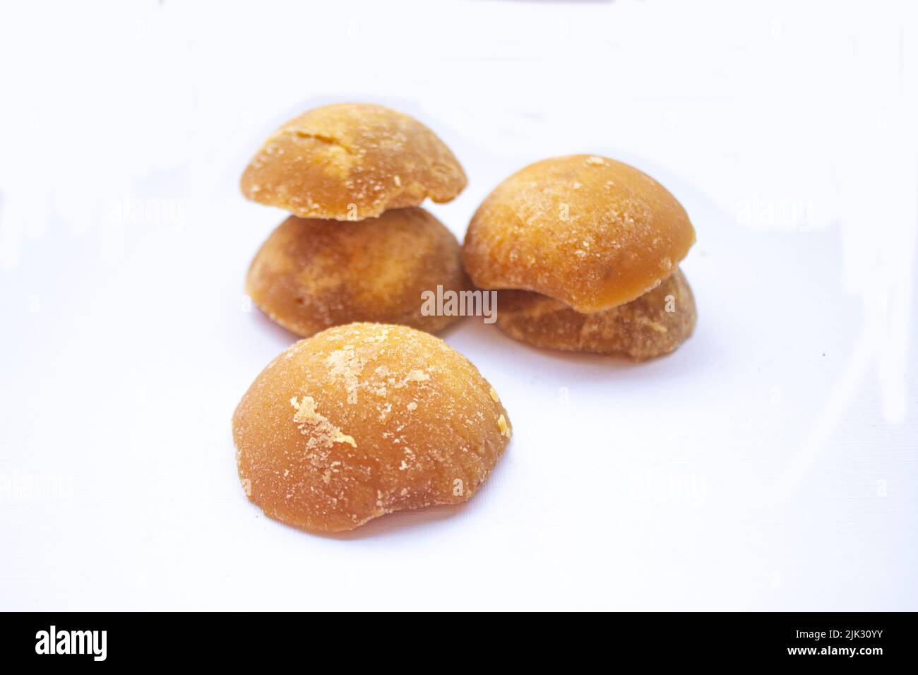 brown sugar or java sugar or palm sugar or gula jawa isolated on white background. Top view. Flat lay. sweet Stock Photo